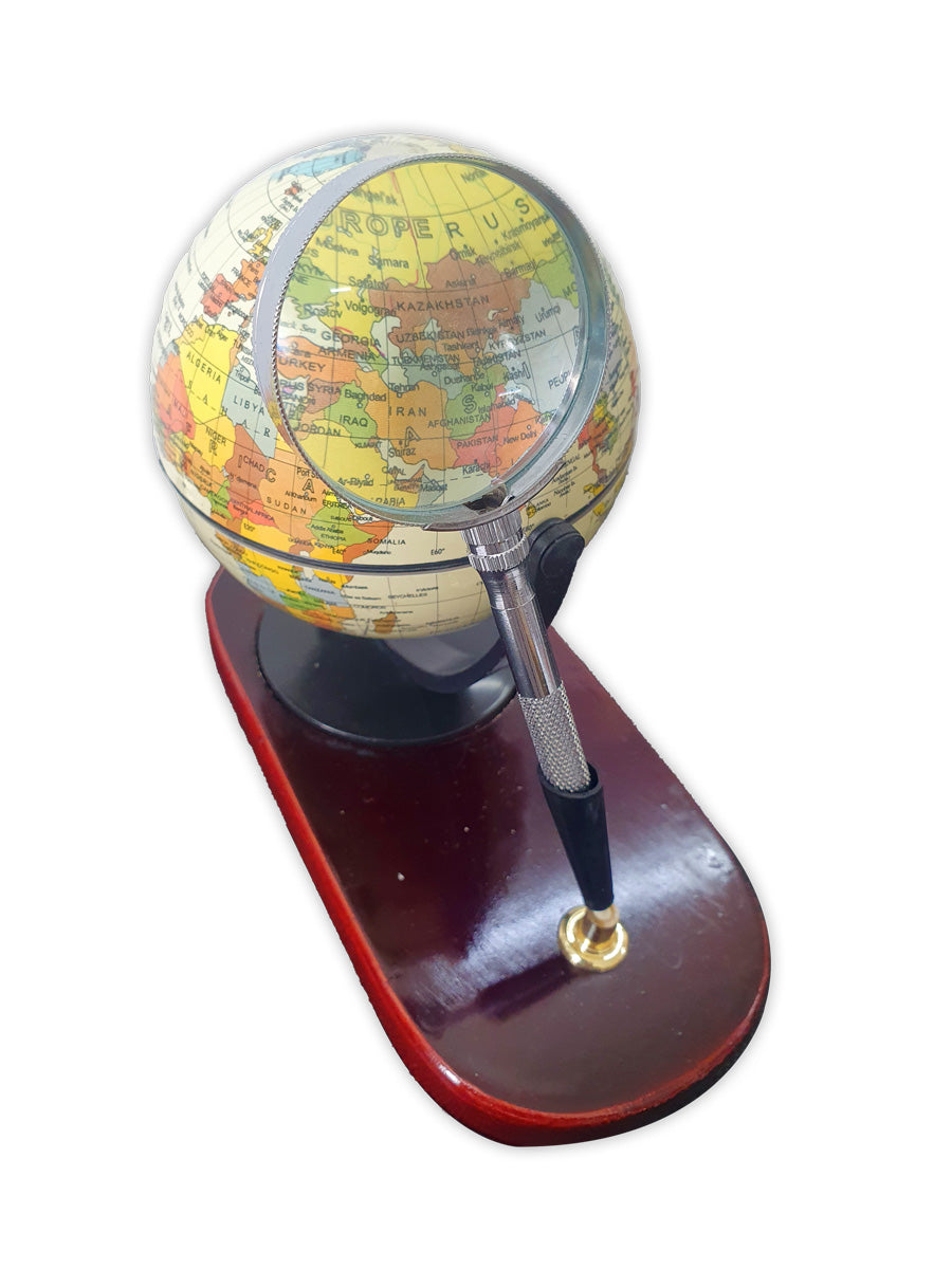 Desktop globe with wooden base and magnifying glass