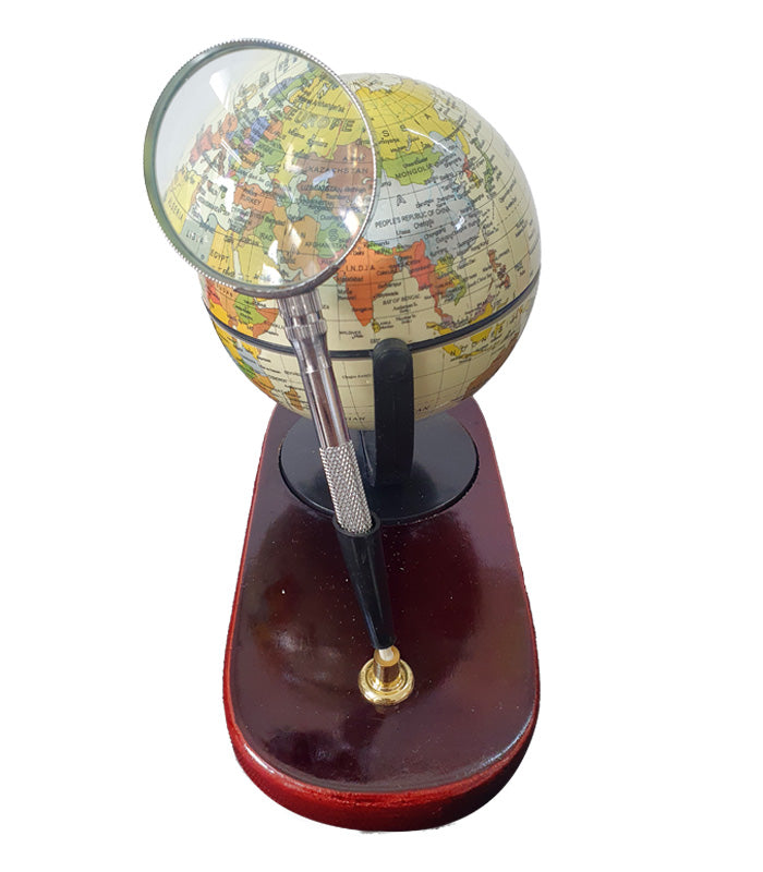 Desktop globe with wooden base and magnifying glass