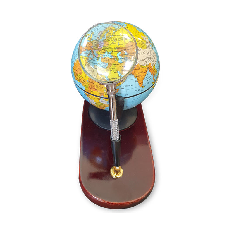 Desktop globe with wooden base and magnifying glass