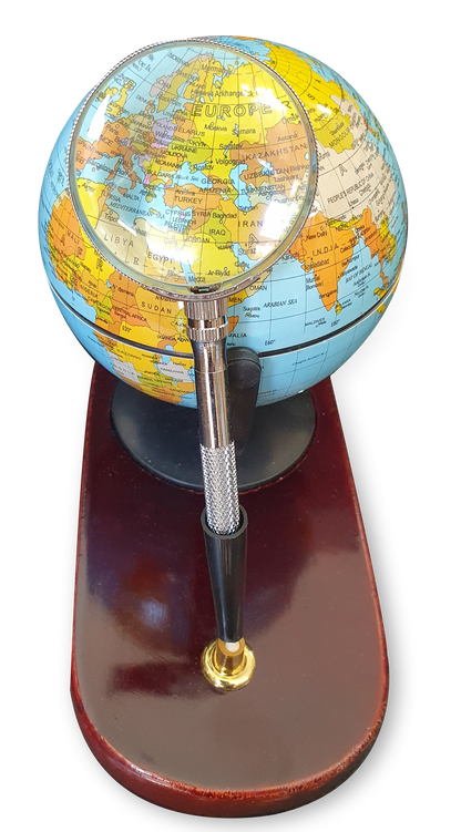 Desktop globe with wooden base and magnifying glass