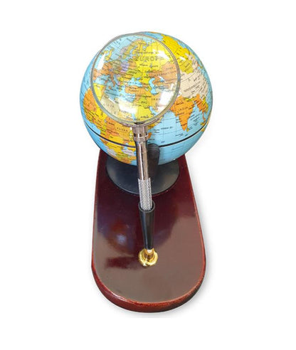 Desktop globe with wooden base and magnifying glass